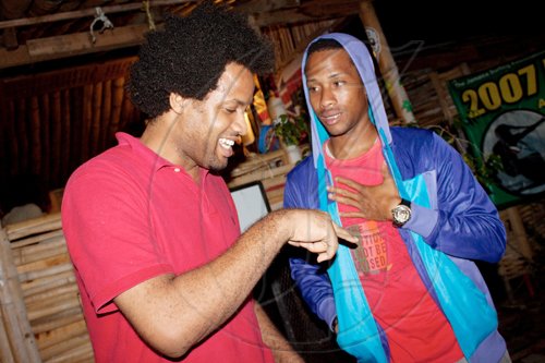 Upcoming stars in the local film production scene, Tarik Kiddoe (left) and Michael Cushnie talk shop at Jamnesia.