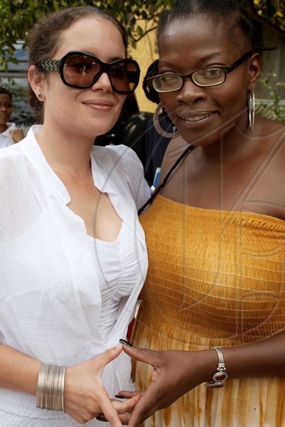Una Morgan of Morgan Heritage fame (right), was on hand with Racquel Reynolds to support her brother, Gramps Morgan, as he performed to the delight of attendees of KIG's Land Rover 2010 Launch.