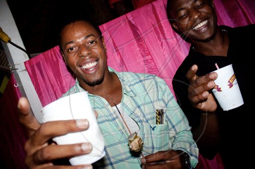 A grilled chicken kebab in one hand and a drink in the other, Foods-R-Us restauranteur Jermaine Everett works the dancefloor at SAKE.