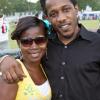 Entertainer Wayne Marshall (right) shows some love to fan Latoya Clarke on the sidelines at the match at "Shoot Out Football Extravaganza".