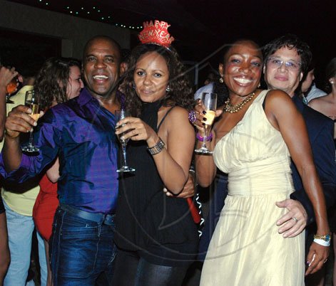 Janet Silvera
From L- Haniff Jones and South African designer, Helen Asrat, Trevor Lyn and Carol Dilbert having an evening of pure joy at Blue Beat's fabulous 'Soiree Bourgeoise' 18th century French themed New Year's Eve party last Thursday night in Montego Bay.