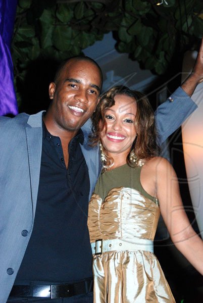 Janet Silvera 
Andre 'P'Nut' Brown poses for the camera with Michelle Charlebare as he enjoyed Blue Beat's 'Soiree Bourgeoise' 18th century French themed New Year's Eve party last Thursday night in Montego Bay