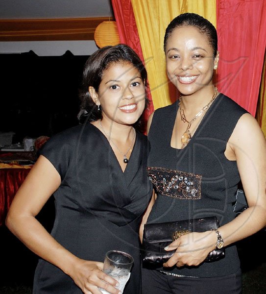 Colin Hamilton/freelance photographer
Senator Marlene Malahoo Forte, chairperson of  Women's Leadership Initiative (WLI) and her deputy Deika Morrison?strike a pose during the Spanish National Day reception at the Spanish Ambassador's residence on Tuesday.

*************************************************************************** October 13, 2009.