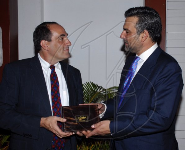 Colin Hamilton/freelance photographer
Joseph Adduci, left presents a box of Adduci Jamaican Cigars to Ambassador DeSilva during the Spanish National Day reception at the Spanish Ambassador's residence on Tuesday October 13, 2009.