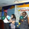 Winston Sill/Freelance Photographer
Enjoying the challenge of the 'balloon game' From left are Errol Campbell, St. Catherine coach, Susan Chang-Pong, director of Tastee's Ltd, Hanif Brown (Jr.) parent of 3rd place champion, and Deborah Thomas (sister of 2001) champion Daniel Thomas).