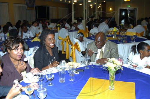 Winston Sill/Freelance Photographer
Enjoying the karoke segment a the Spelling Bee dinner are (from left) Pamela Black, Promotions Assistance at Lasco Distributor's Ltd, Kathryn Lewis, 1998 National Champion, Norman Marshall, Managing Director Sangster's Book Stores and Andrien Cribb, St. James Parish Champion.