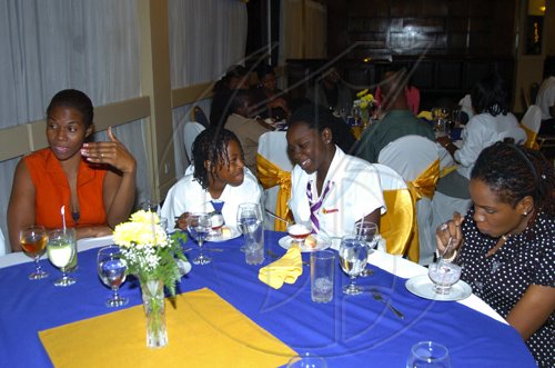 Winston Sill/Freelance Photographer
Past champions Sade Dunbar and Regina Bish (2008 and 2007) respectively) share a conversation at the Spelling Bee Dinner from left are Ann Marie Jamieson-Harty St. James coach and Denise Manning (aunt of 2007 Champion).