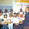 Winston Sill/Freelance Photographer
Tenesia Malcolm, gleaner's Children's Own Co-ordinator presents a gift basket on behalf of Continental Baking Company.