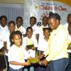 Winston Sill/Freelance Photographer
Georgia Cunningham, representative of Mall and Tropical Jewellers present a watch to Lariecia Harvey, Trelawny parish champion.
