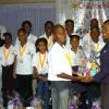 Winston Sill/Freelance Photographer
Sandra Geohagan-Green, Promotions Co-ordinator of Lasco Distributor's Ltd presents a gift basket to Champion Boy Owayne Rodney.