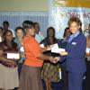 Winston Sill/Freelance Photographer
DonnaMarie Brooks-Gordon, Public Relations and Promotion Executive of Courts presents a gift voucher to Marlise Cowie-Adianasing, teacher of the Portland parish champion.