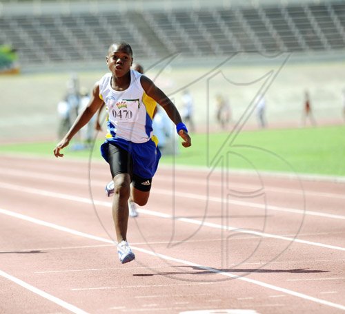 Ricardo Makyn/Staff Photographer.
Dejour Russell winning Heat one of the Boys Class 2 100 Metres  at the Bigga/Jisa Prep School Champs on Day Two at the National Stadium on Friday 5.6.2009.
