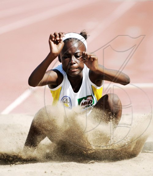 Ricardo Makyn/Staff Photographer.
Amanda Carty of Hydel Prep lands in the sand pit while competing  in the Girls Long Jump Class One event at the Bigga/JISA Prep Schools Championships, on day two at the National Stadium yesterday.