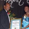 Colin Hamilton/freelance photographer
Olympic Medallist Sherika Williams receives a sports?award from Mr Kenny Jackson (Chairman - Homecoming Week Committee) during St. Elizabeth Homecoming Foundation 17th Annual Golden Awards Banquet held at the Pegasus Hotel on Wednesday November 25, 2009.