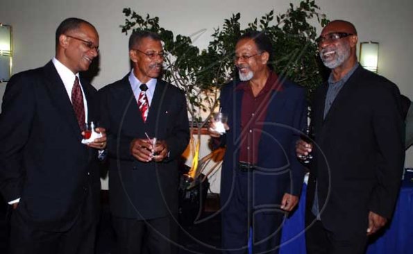 Colin Hamilton/freelance photographer
From left,  Sen. Arthur Williams, Ewart Lobban, Leeroy Dixon and Winston Barrett shared some oldtime stories during the 
St. Elizabeth Homecoming Foundation 17th Annual Golden Awards Banquet held at the Pegasus Hotel on Wednesday November 25, 2009.