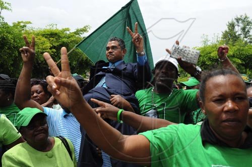 Ian Allen/Staff Photographer
Michael Stern being carried by supporters outside the Supreme Court after the judge ruled that a Bi-election is to be held in the North West Clarendon constituency.