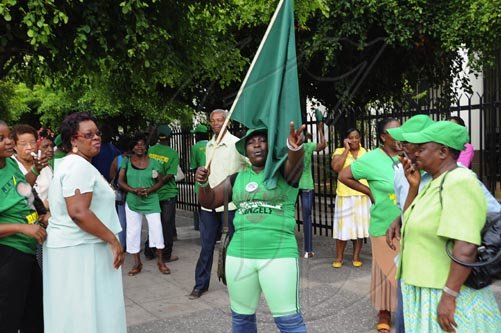 Ian Allen/Staff Photographer
Jamaica Labour Party supporters waiting outside the  Supreme Court for a ruling on the Michael Stern/ Richard Azan dual citizenship case and wether a bi-election is to be held in the North West Clarendon constituency.
