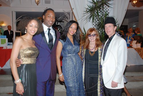 Janet Silvera Photo
 
From left: Stephanie Lyle-Brown, Lennox Lewis and wife Violet pose with woman who dresses so many, Nicole Miller and husband, Kim Taitpale.

****************************************************************************** at the Hanover Charities Sugar Cane Ball at the Round Hill Hotel and Villas last Saturday night.