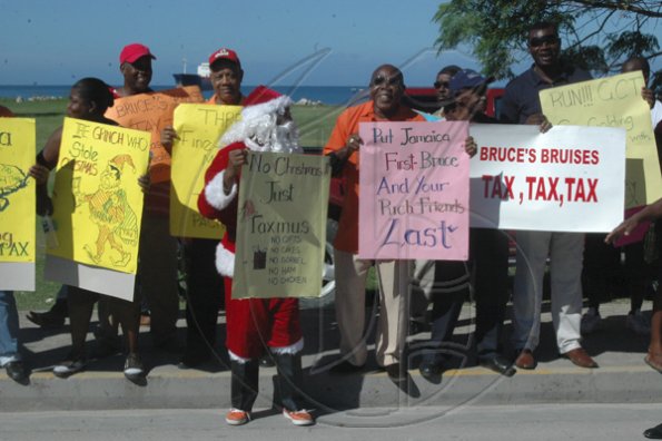 PNP vice president Derrick Kellier (3rd from left) participate in the party's Region Six demonstration along the Howard Cooke Boulevard, in Montego Bay, yesterday.