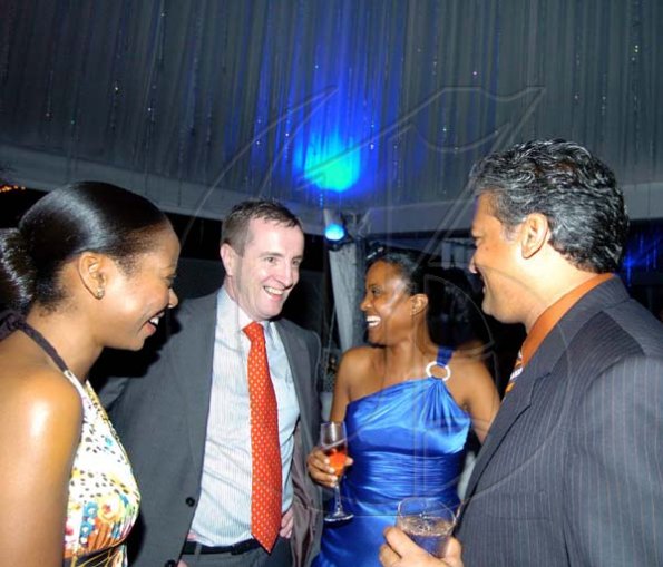 Winston Sill / Freelance Photographer
Digicel Jamaica boss Mark Linehan (second left) and wife Leisha Linehan (left) joke with Trisha Thompson and her beau Nari Williams-Singh.



Terra Nova All-Suite Hotel, New Year-Eve Ball, held on the lawns of the Hotel, Waterloo Road on Thursday night December 31, 2009.  (right).