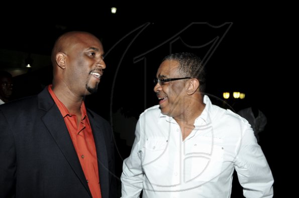 Winston Sill / Freelance Photographer
Launch and book signing of Usain Bolt book, "My Story 9.58-- Being The World,s Fastest Man", held at the Terra Nova All-Suite Hotel, Waterloo Road on Thursday night October 21, 2010. Here are Norman Peart (left), Bolt's Manager; and Ian Randle (right).