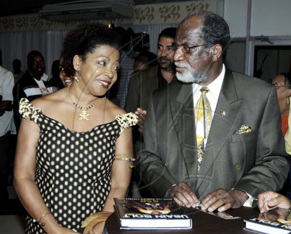 Winston Sill / Freelance Photographer
Professor Verene Shepherd sxhares something pleasant with  Ryland Campbell,  chairman, Capital and Credit Financial Group at the launch and  signing of Usain Bolt's book, "My Story 9.58-- Being The World's Fastest Man"  at the Terra Nova All-Suite Hotel, Waterloo Road in St Andrew.

**************************************************************************on Thursday night October 21, 2010. Here are Prof. Verene Shepherd (left); and Ryland Campbell (right), Chairman, Capital and Credit Financial Group.