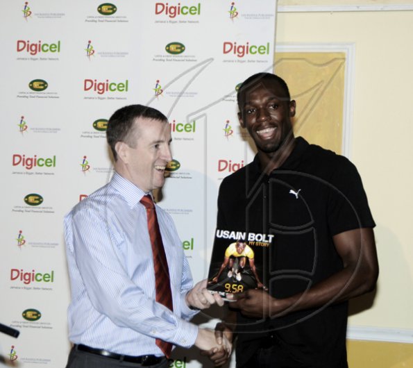 Winston Sill / Freelance Photographer
Launch and book signing of Usain Bolt book, "My Story 9.58-- Being The World,s Fastest Man", held at the Terra Nova All-Suite Hotel, Waterloo Road on Thursday night October 21, 2010. Here are Mark Linehan (left), CEO, Digicel; and Bolt (right).