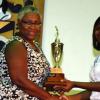 Colin Hamilton/freelance photographer
President of the Jamaica Netball Association, Mrs Marva Bernard presents team captain Nicole Johnson with an award during UTECH Annual Sports Awards Ceremony at the Alfred Sangster Auditorium on Thursday February 11, 2010.
