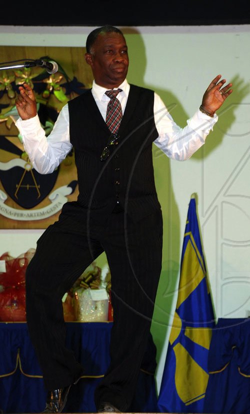Colin Hamilton/freelance photographer
Guest speaker Mr. Sydney Bartley (Principal Director, Entertainment and Culture,- Ministry of Youth, Sports and Culture) shows some dance moves as part of his          address during UTECH Annual Sports Awards Ceremony at the Alfred Sangster Auditorium on Thursday February 11, 2010.