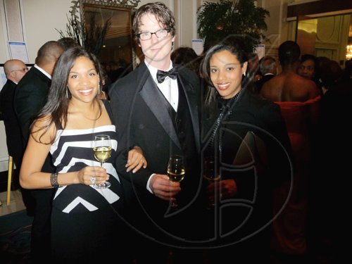 Peter Sanagan must certainly feel lucky as he is sandwiched by the pretty Hussey sisters, Alia (left) and Dominique.

******************************************************************************** at the Inaugural UWI Toronto benefit gala on Saturday evening at Hotel Four Seasons, Toronto, Canada.

Latoya Grindley/Staff Reporter
UWI Gala on Saturday February 27, 2010.