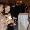 Gem Cover (left) and Beverley Thompson are intrigued by this art work; one of the many attractive pieces featured during the silent auction at Saturday's Inaugural UWI Toronto Gala at the Four Seasons Hotel in Toronto, Canada.

*************************************************************

Latoya Grindley/Staff Reporter
UWI Gala on Saturday February 27, 2010.