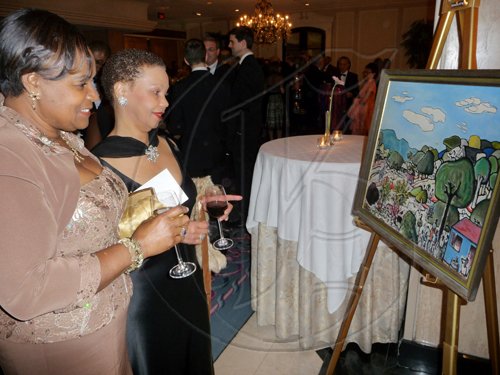 Gem Cover (left) and Beverley Thompson are intrigued by this art work; one of the many attractive pieces featured during the silent auction at Saturday's Inaugural UWI Toronto Gala at the Four Seasons Hotel in Toronto, Canada.

*************************************************************

Latoya Grindley/Staff Reporter
UWI Gala on Saturday February 27, 2010.
