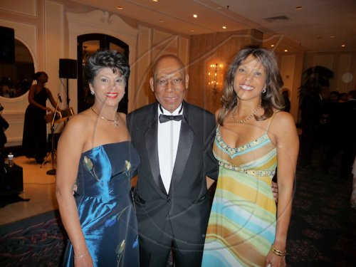 Winston Bailey is content in the arms of Juliette Walker (left), aunt of Elizabeth Buchanan Hind (right), key personnel in the organisation and execution of the successful staging of the inaugural UWI Toronto gala in Toronto, Canada.
********************************************************************************

Latoya Grindley/Staff Reporter
UWI Gala on Saturday February 27, 2010.