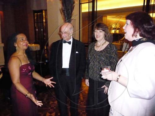 Marguerite Orane (left) is in an expressive mood to recipient of the University of the West Indies Vice Chancellor award, Robert Moore, wife Barbara (second right) and daughter Fauzya Moore. 

*******************************************************************************They were guests at the Inaugural UWI Toronto gala at the Four Seasons hotel in Toronto, Canada.

Latoya Grindley/Staff Reporter
UWI Gala on Saturday February 27, 2010.
