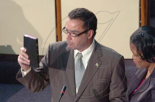 Rudolph Brown/Chief Photographer
Daryl Vaz, swearing as member of parliament for West Portland, at Gordon House on Tuesday, March 31-2009.