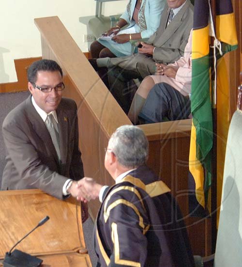 Rudolph Brown/Chief Photographer
Daryl Vaz, swearing as member of parliament for West Portland, at Gordon House on Tuesday, March 31-2009.