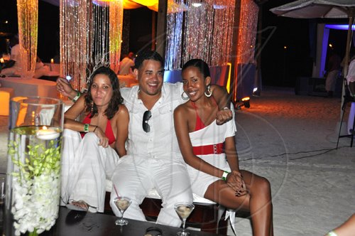 Janet Silvera Photo
 
From left:  Deidre Gomes, Jason Watt and Jessica Folkes prefer to just relax at the party.

*************************************************************at 'The Weekend's' Vertigo All White beach party at The Palmyra last Sunday.
