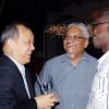 Colin Hamilton/freelance photographer
UWI Vice Chancellor Professor E. Nigel Harris (centre) gets a good laugh with Chinese Ambassador Chen Jinghua (left) and Willie Iton at his reception.

 at #1 Long Mountain Road on Tuesday December 29, 2009.