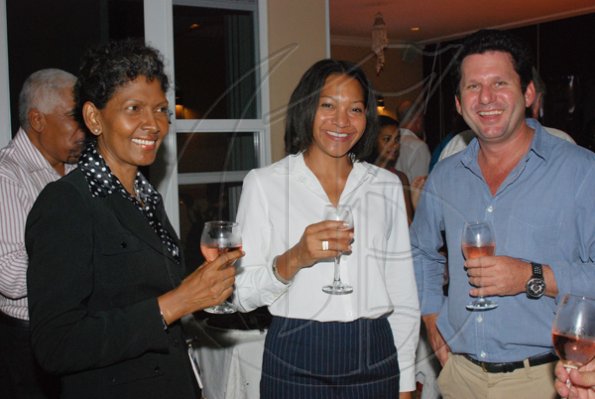 Janet Silvera Photo
From L- Corporate Connection?s Pauline Reid, KPMG?s Karen Burgess and CPJ?s Mark Hart at the Club de Vin's monthly wine meeting at Veena and Denny Chandiram?s home at The Lagoons in Montego Freeport last Thursday evening.