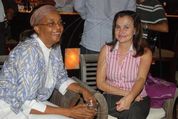 Janet Silvera Photo
From L- Valerie Campbell and Lola Bosque at Club de Vin's monthly wine meeting at Veena and Denny Chandiram?s home at The Lagoons in Montego Freeport last Thursday evening.