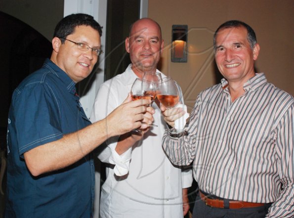 Janet Silvera Photo
From L- Billy Craig?s William Craig, CPJ?s Tom Tyler and MBJ Airports? Fernando Bosque at Club de Vin's monthly wine meeting at Veena and Denny Chandiram?s home at The Lagoons in Montego Freeport last Thursday evening.