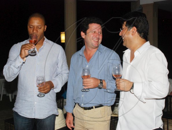 Janet Silvera Photo
From L- CPJ?s Mark Hart and host Denny Chandiram at Club de Vin?s monthly wine meeting at the Chandiram?s home at The Lagoons in Montego Freeport last Thursday evening.