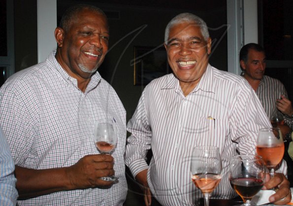 Janet Silvera Photo

Airports Authority of Jamaica's Denton Campbell (left) and Continental Airline's Tom Scarlett were all smiles at the Club de Vin's wine meeting at Veena and Denny Chandiram's home at The Lagoons in Montego Freeport last Thursday night.