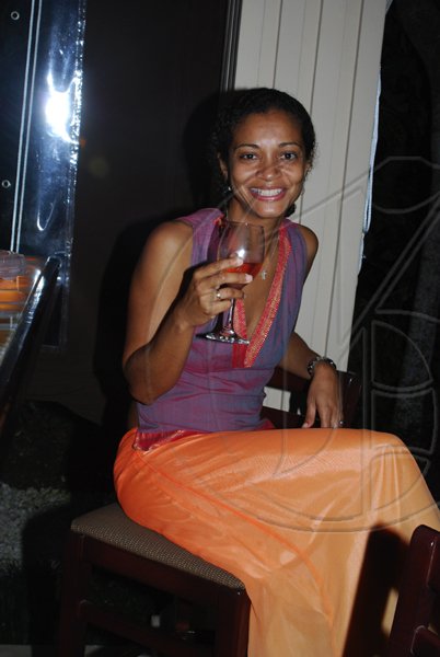 Janet Silvera Photo
Candace Craig enjoying every moment of the Rose 'Whispering Angel' introduced by Caribbean Producers at Club de Vin?s monthly wine meeting at Veena and Denny Chandiram?s home at The Lagoons in Montego Freeport last Thursday evening.
