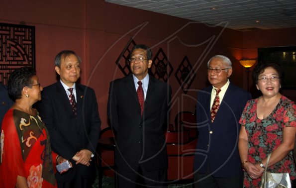 Winston Sill / Freelance Photographer
Deputy Prime Minister Dr Ken Baugh (centre) is literally in the middle of things at the Jamaica China Friendship Association (JCFA) banquet. Hobnobbing with him are (from left) Fay Pickersgill, president of the association; Chinese Ambassador Chen Jinghua; Wilson Look-Kin, president of the Chinese Benevolent Association; and his wife Delores.

 to celebrating the 60th Anniversary of the Founding of The Peoples's Republic of China, held at Jade Garden Restaurant, Sovereign Centre on Sunday October 11, 2009.