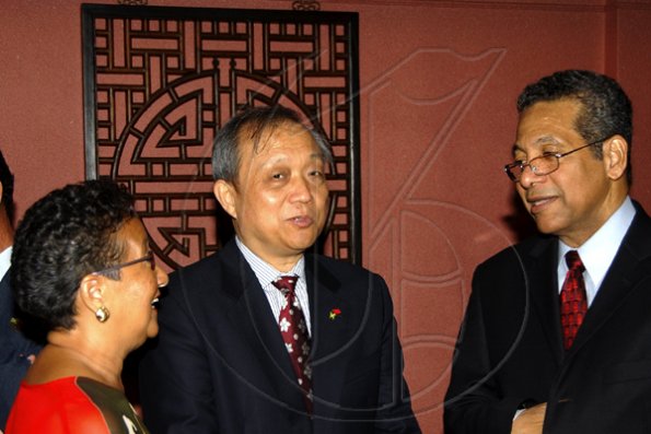 Winston Sill / Freelance Photographer
Deputy Prime Minister Dr Ken Baugh (right) jokes with Chinese Ambassador Chen Jinghua (centre) and Fay Pickersgill, president of the Jamaica China Friendship Association.

 (JCFA) banquet to celebrating the 60th Anniversary of the Founding of The Peoples's Republic of China, held at Jade Garden Restaurant, Sovereign Centre on Sunday October 11, 2009.