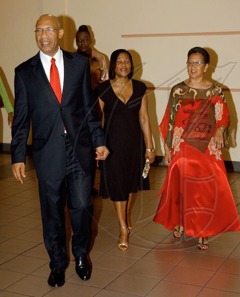 Winston Sill / Freelance Photographer
President of the Jamaica China Friendship Association Fay Pickersgill (right) escorts Governor General Sir Patrick Allen and Lady Allen to the banquet to celebrate the 60th anniversary of the founding of The Peoples's Republic of China, held at Jade Garden Restaurant, Sovereign Centre on Sunday October 11, 2009.