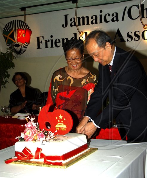 Winston Sill / Freelance Photographer
Chinese Ambassador Chen Jinghua and Fay Pickersgill, president of The Jamaica China Friendship Association cut the birthday cake to celebrate the 60th anniversary of the founding of The People's Republic of China, held at Jade Garden Restaurant, Sovereign Centre on Sunday October 11, 2009.