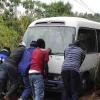 Ian Allen/Photographer
Residents of Guava Ridge in Mavis Bank push a bus that was stuck in mud from a in a landslide along the Guava Ridge to Mavis Bank main road.