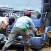 Ian Allen/Photographer
Residents of Guava Ridge in rural St.Andrew help to clear a vehicle that was stuck in mud from landslides caused by the overnight rains in the area.